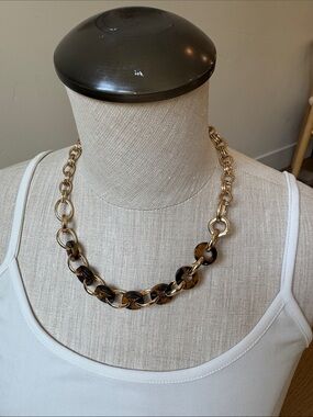 White House Black Market gold and tortoise necklace.